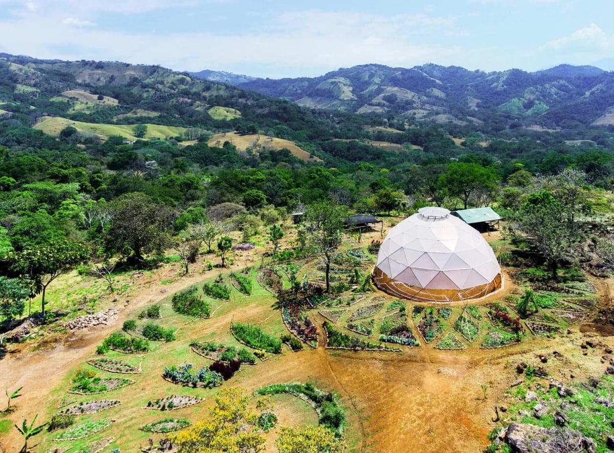 Aerial view of Alegría Village gardens and hills in Costa Rica